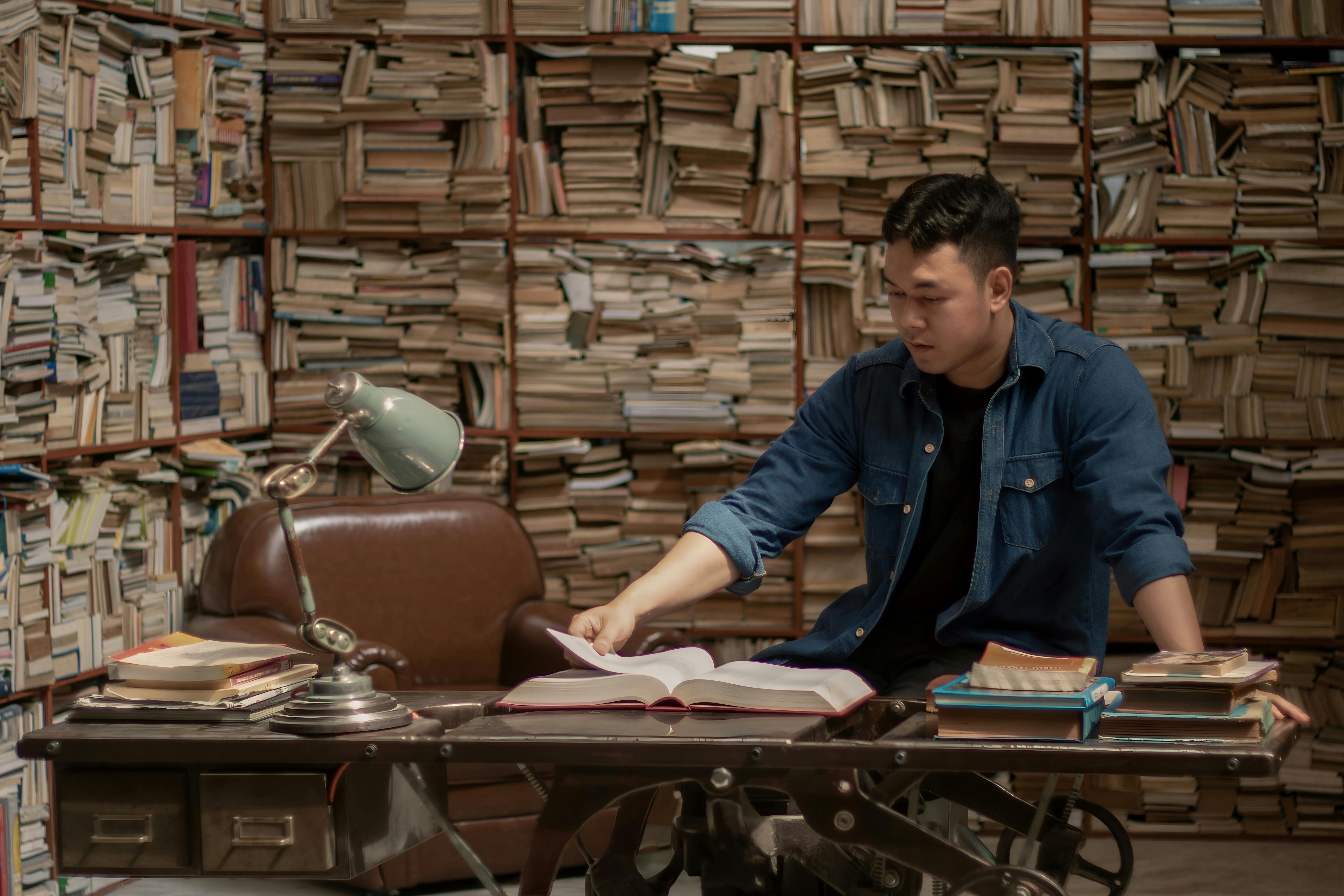 Man reading a book quietly, symbol of focus and growth