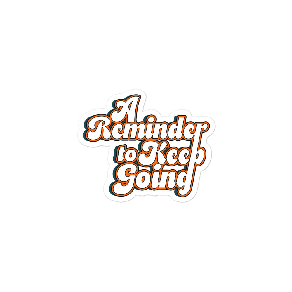 Close-up of black and white Keep Going motivational sticker