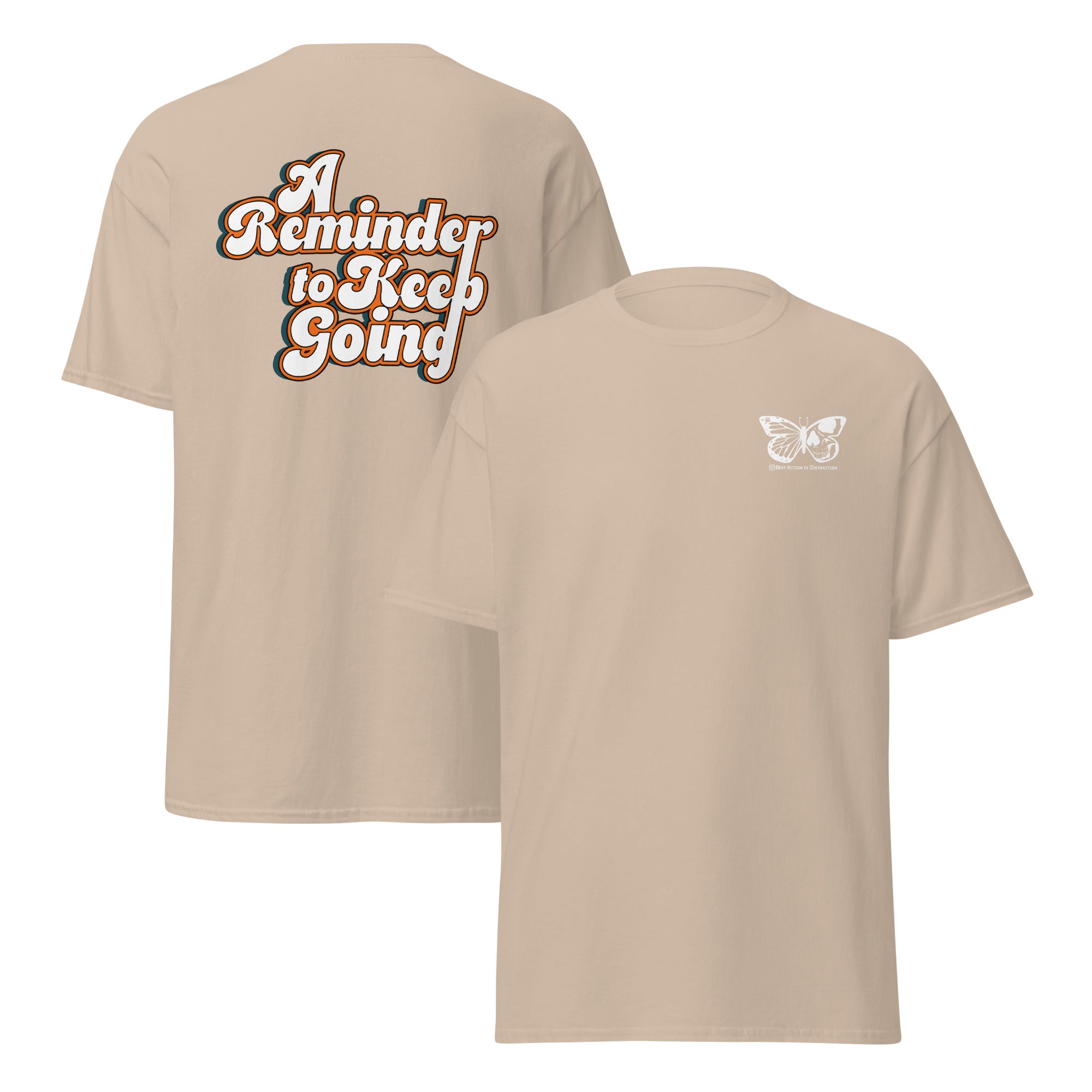 Beige t-shirt with text 'A Reminder to Keep Going' on the back and a butterfly design on the front, on a white background.