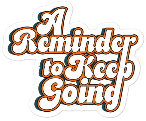 Close-up of black and white Keep Going motivational sticker