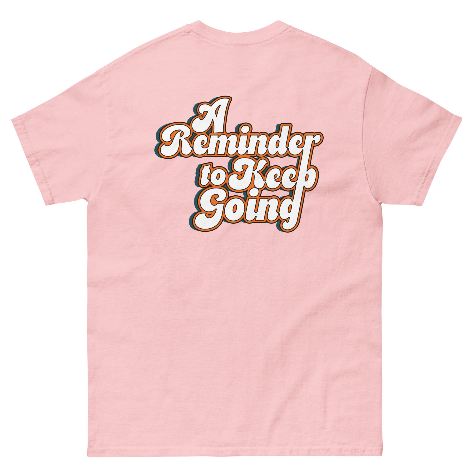 Pink t-shirt with 'A Reminder to Keep Going' text on a white background