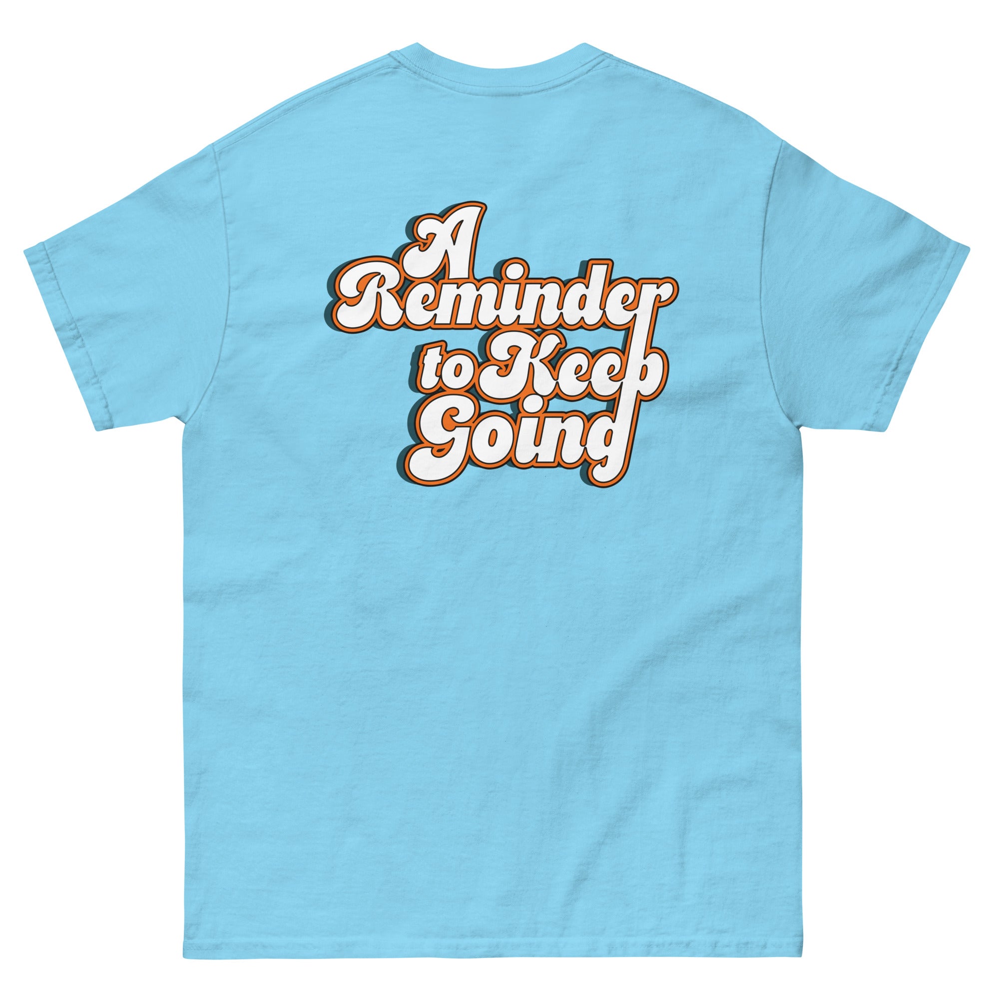 Light blue t-shirt with 'A Reminder to Keep Going' text on a white background