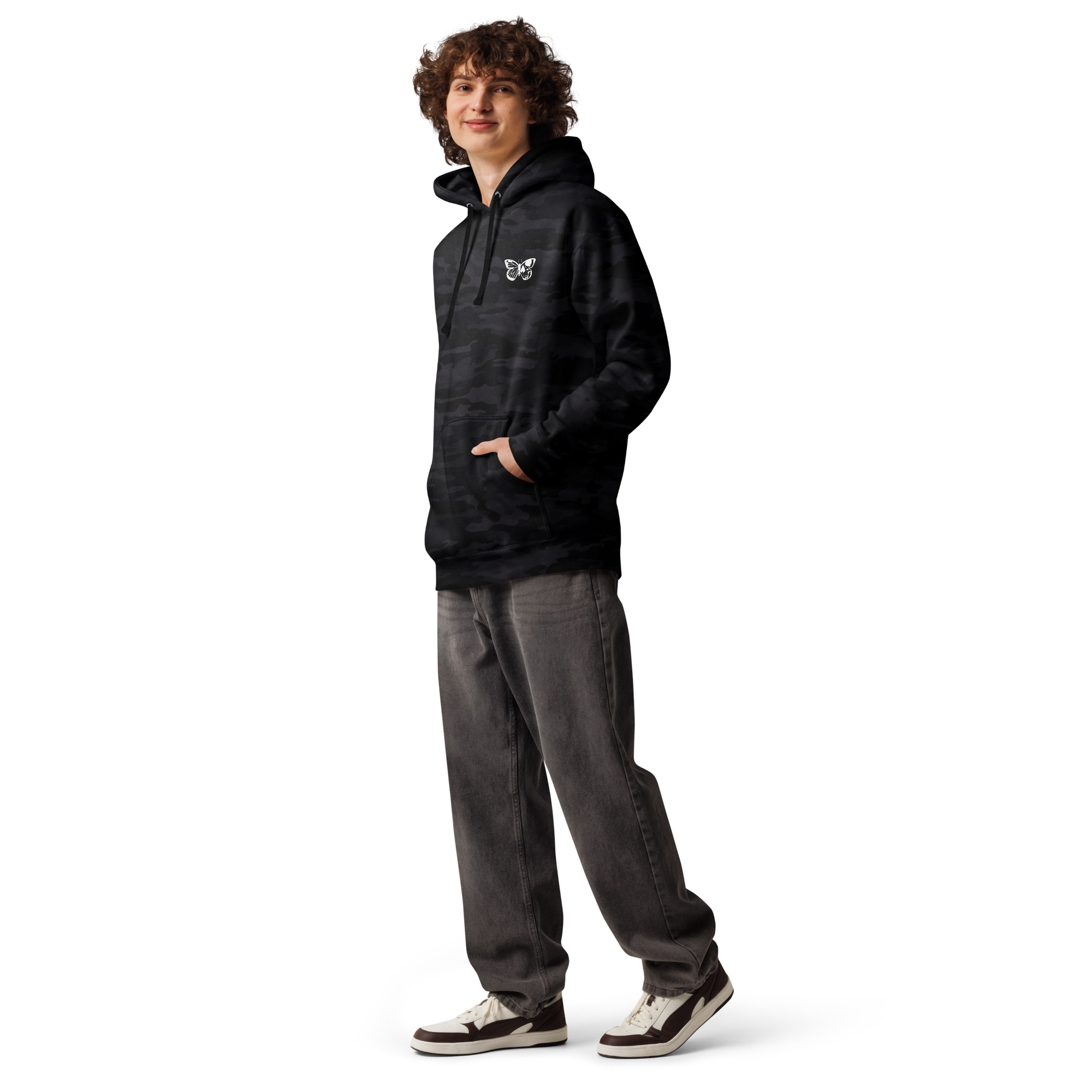Person wearing a black hoodie and gray pants on a white background