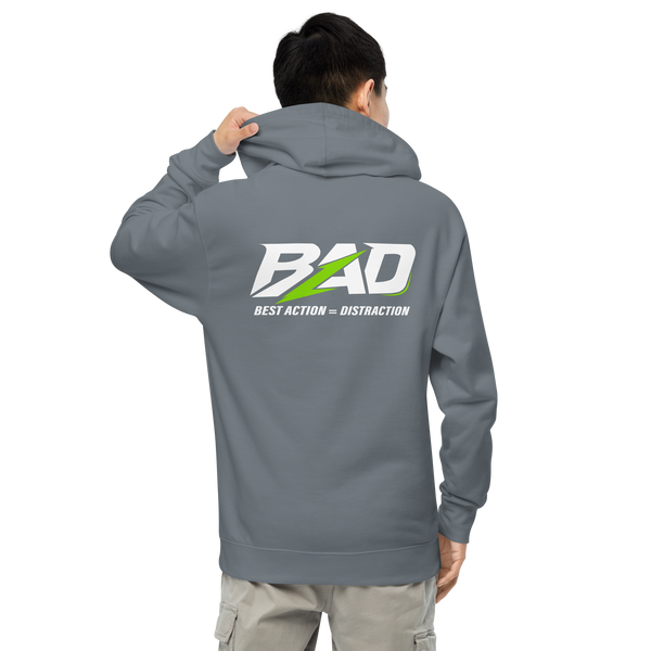 Person wearing a gray hoodie with 'BAD' logo on the back